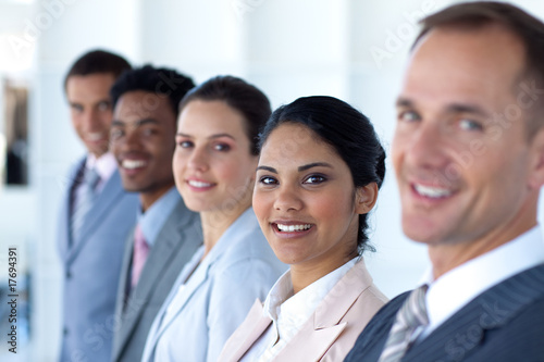 Beautiful businesswoman with her team in a line