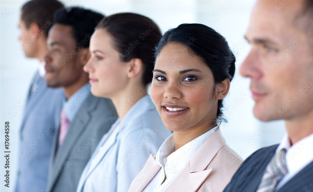 Confident businesswoman with her team in a line