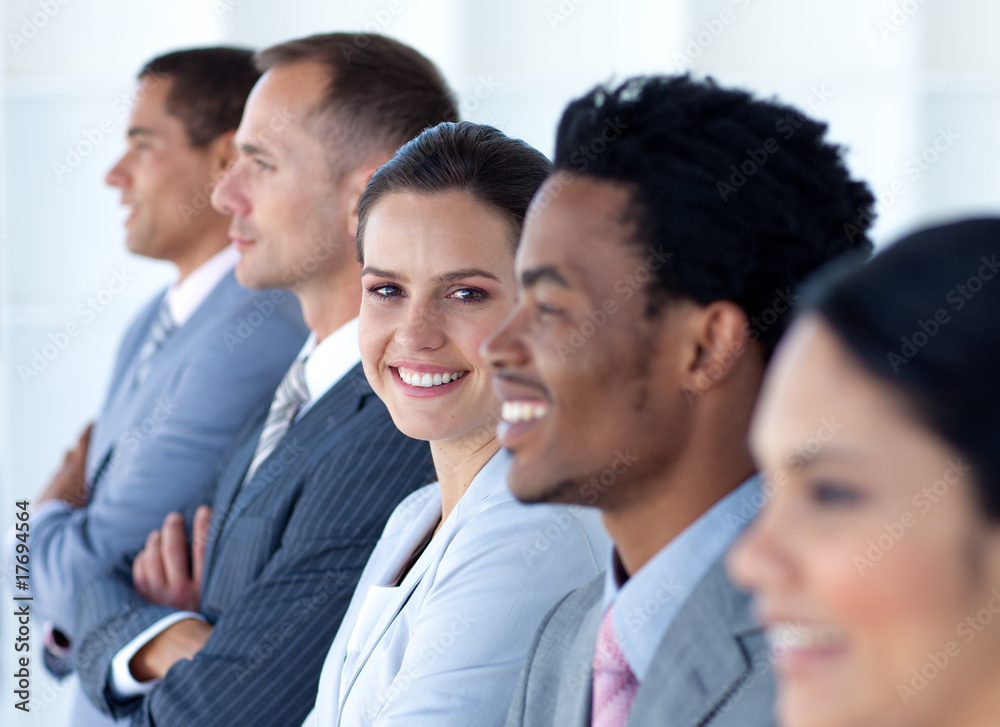 Confident businesswoman with her team in a line Confident businesswoman with her team in a line