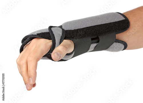 Human hand with a wrist brace, orthopeadic equipment photo