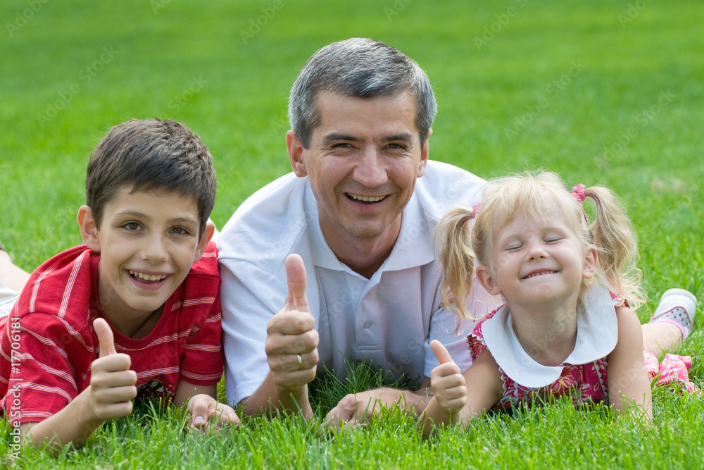 smiling family at the park smiling family at the park