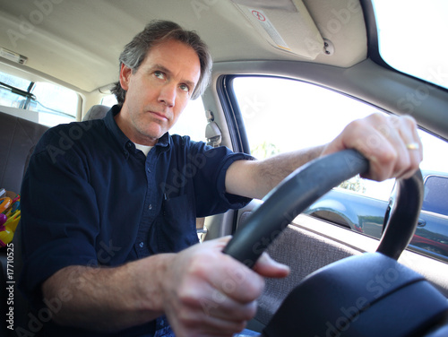 a middle aged man driving