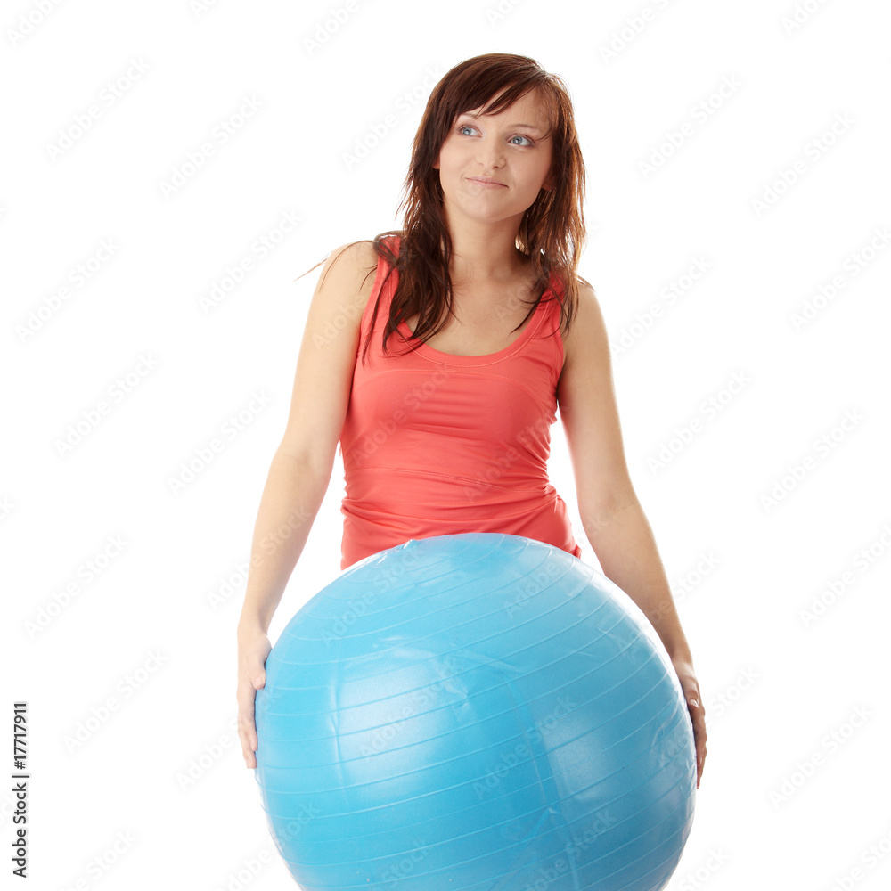Young happy woman doing fitness exercise Young happy woman doing fitness exercise