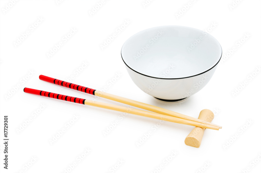 Bowl and chopsticks isolated on the white Bowl and chopsticks isolated on the white