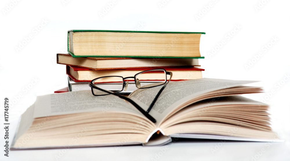 Books and glasses on white. Contains clipping path. Books and glasses on white. Contains clipping path.