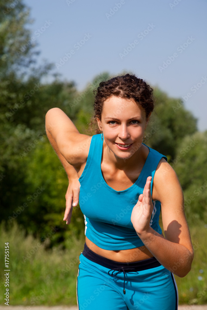 young attractive woman starting to run ourdoors young attractive woman starting to run ourdoors