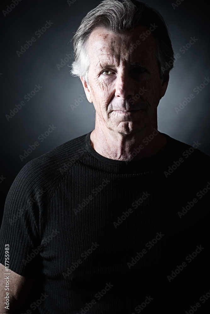 Obraz premium Low Key Shot of Handsome Senior Male