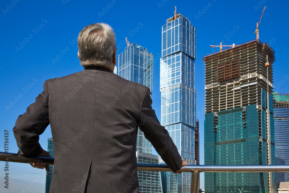 Senior man on skyscraper background Senior man on skyscraper background
