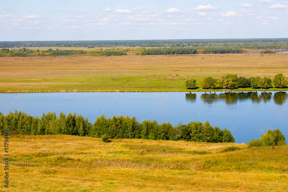 Beautiful river and yellow meadow