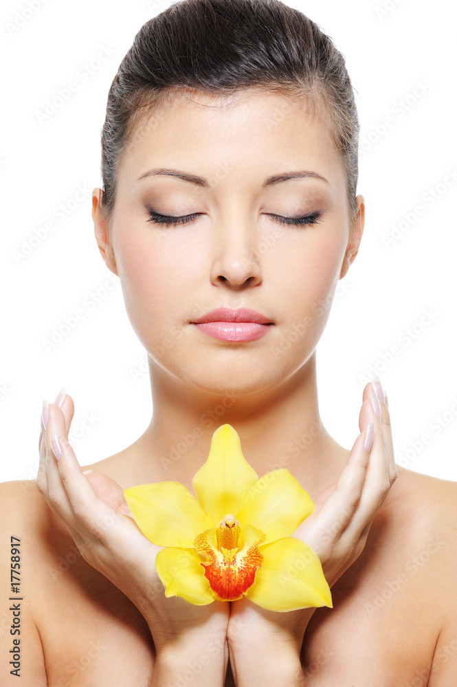 beauty asian woman relax with flower in hands beauty asian woman relax with flower in hands