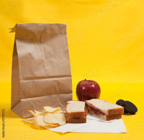 Sack lunch with peanut butter sandwich photo