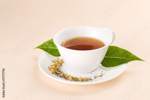 Red tea with green leaf