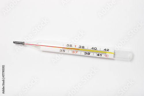 glass thermometer with red indicator showing 37.7 degrees photo