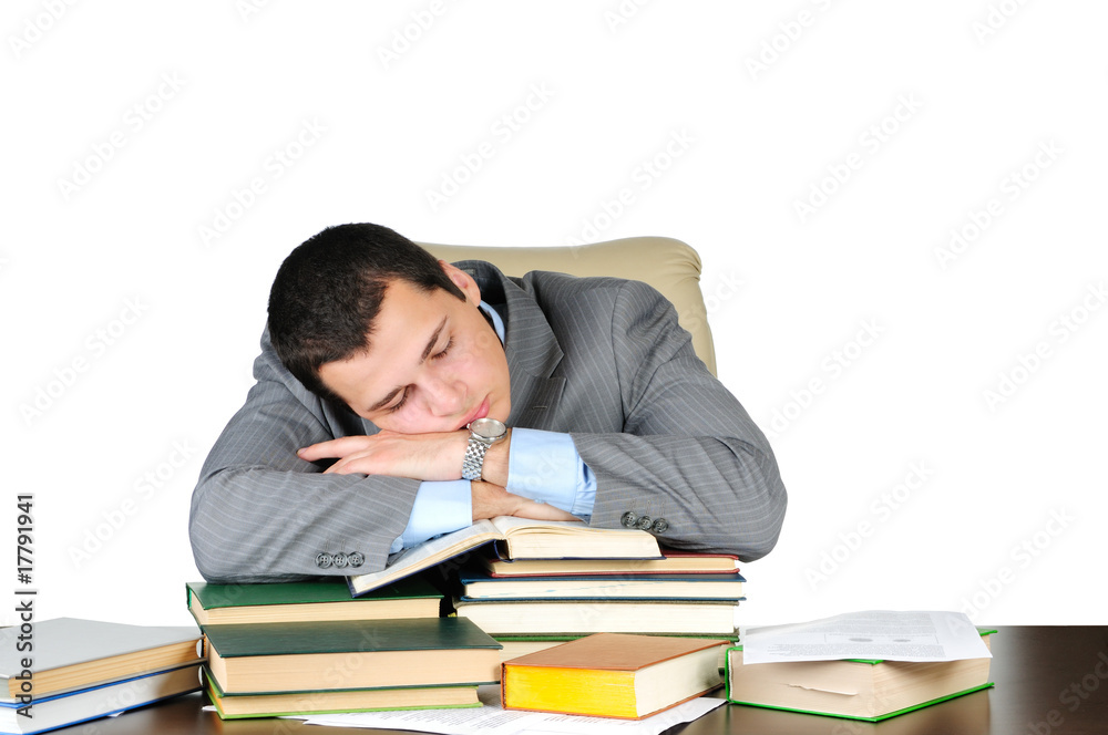 Business man sleeping on book heaps isolated on white Business man sleeping on book heaps isolated on white