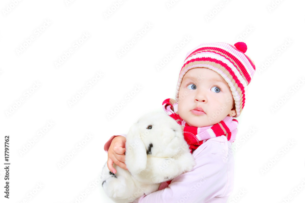 toddler girl with toy rabbit over white