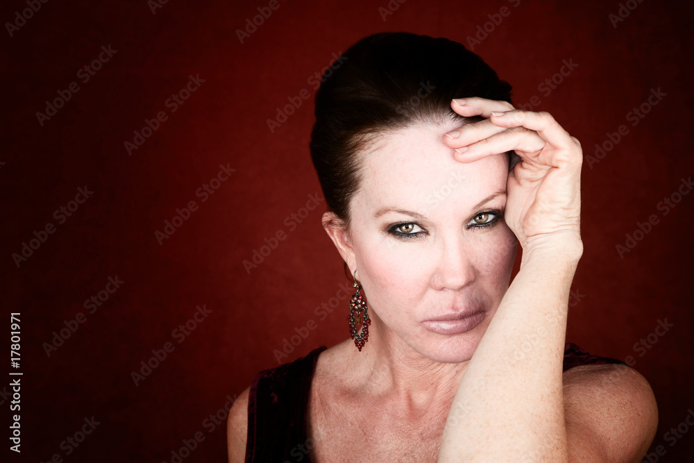 Fototapeta premium Beautiful Woman on a Red Background