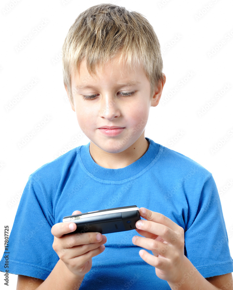 little boy experimenting with a cellphone