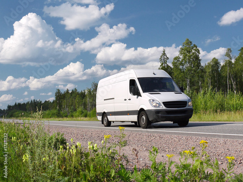 white van on rural highway, landscape photo