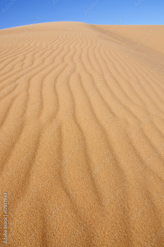 desert sand dune with blue sky