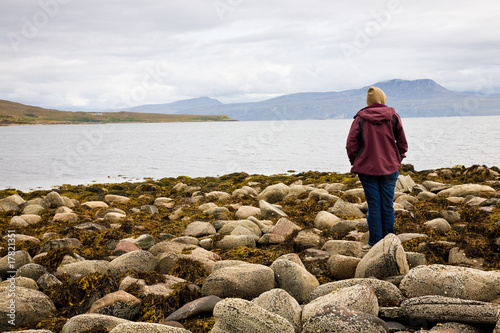 Canvas Print Woman looking at sea, Scotland