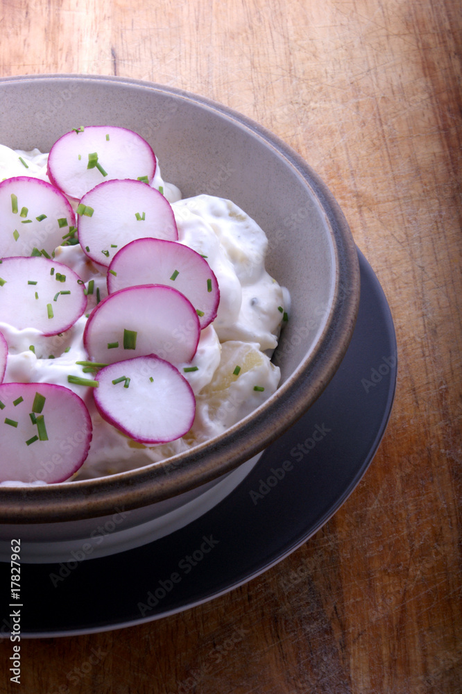 potato salad with mayonnaise and radish in a bowl