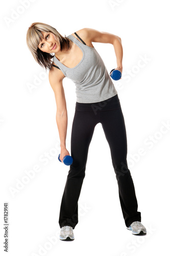 Sportswoman with dumbbells