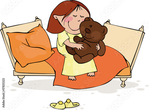 The little girl sits in the bed with a favourite toy