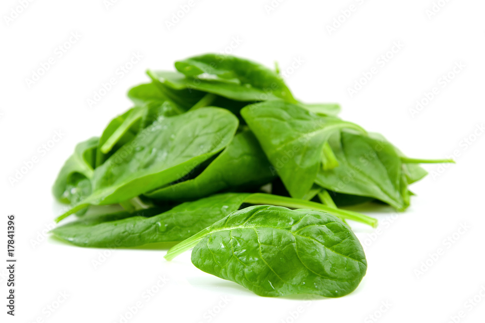 stacked fresh spinach over white backround stacked fresh spinach over white backround