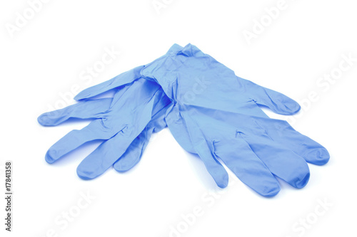 Blue medical gloves over white background