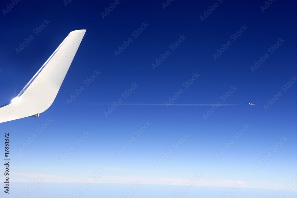 Fototapeta premium Aircraft wing detail flying high up