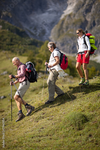 family hiking on beautiful summer day