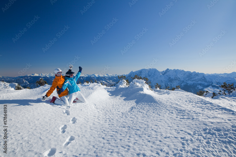 couple having fun aside from slope