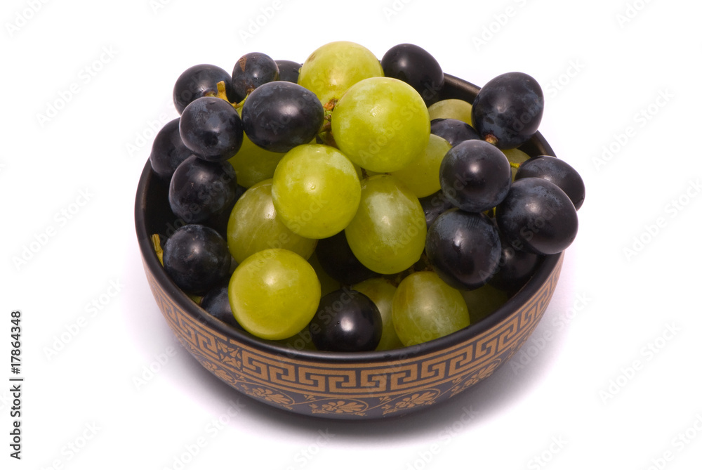 Green and blue grapes on a studio white background Green and blue grapes on a studio white background