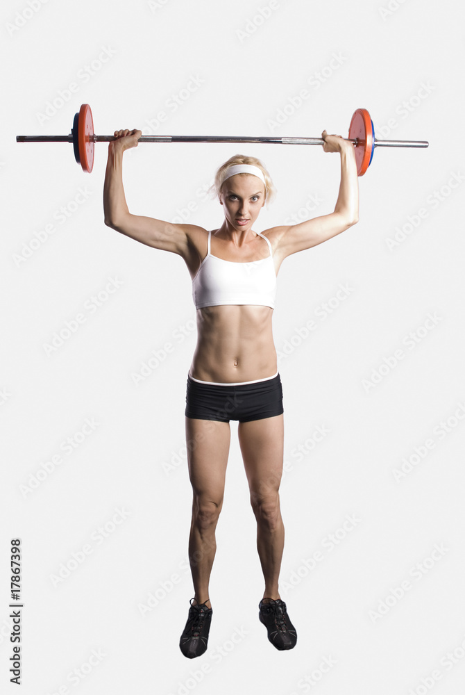 Obraz premium beautiful young girl with a dumb-bell