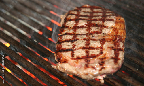 Ribeye steak on grille