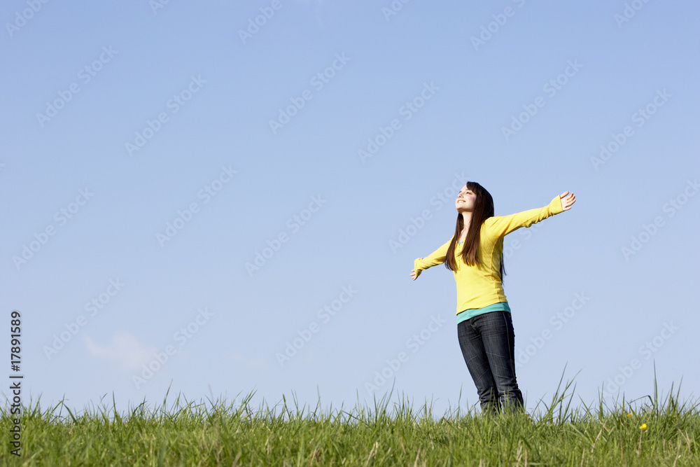 Teenage Girl Standing In Summer Meadow Teenage Girl Standing In Summer Meadow