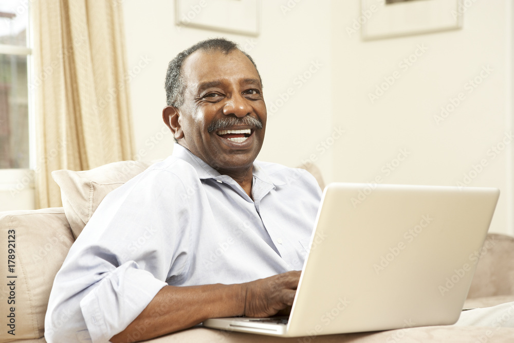 Senior Man Using Laptop At Home Senior Man Using Laptop At Home