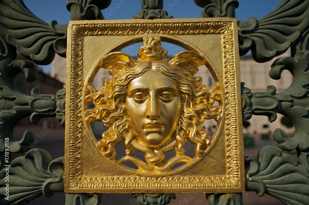 Face on the Royal Palace of Turin's gate