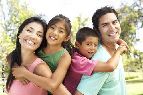 Young Family Having Fun In Park