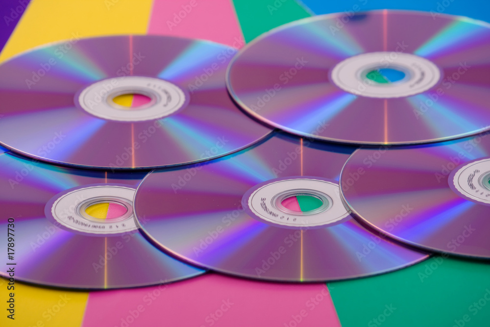 Many CD's on the colorful background Many CD's on the colorful background