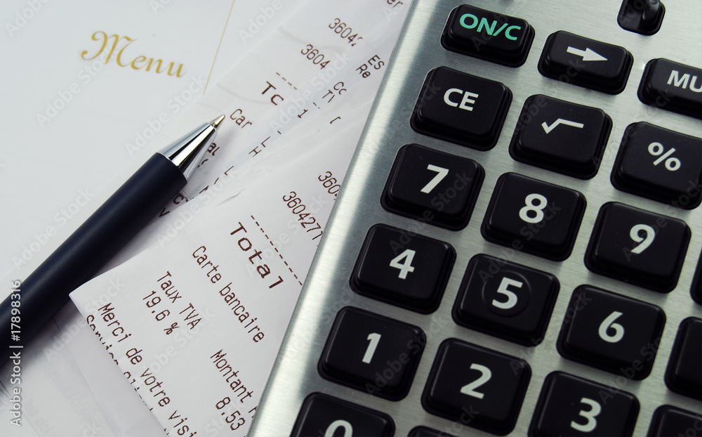 A calculator with a receipt and menu A calculator with a receipt and menu