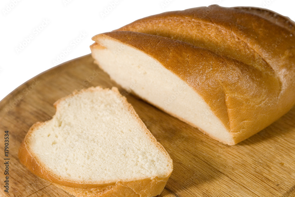 Closeup of a cut baguette on a wooden plate