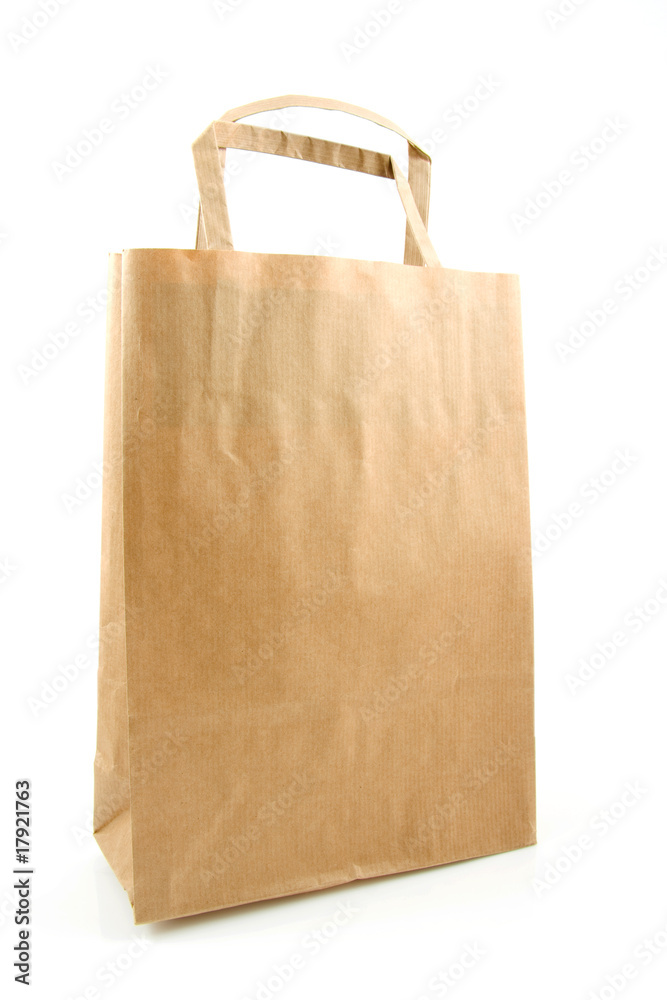 Empty paper shopping bag over white background Empty paper shopping bag over white background