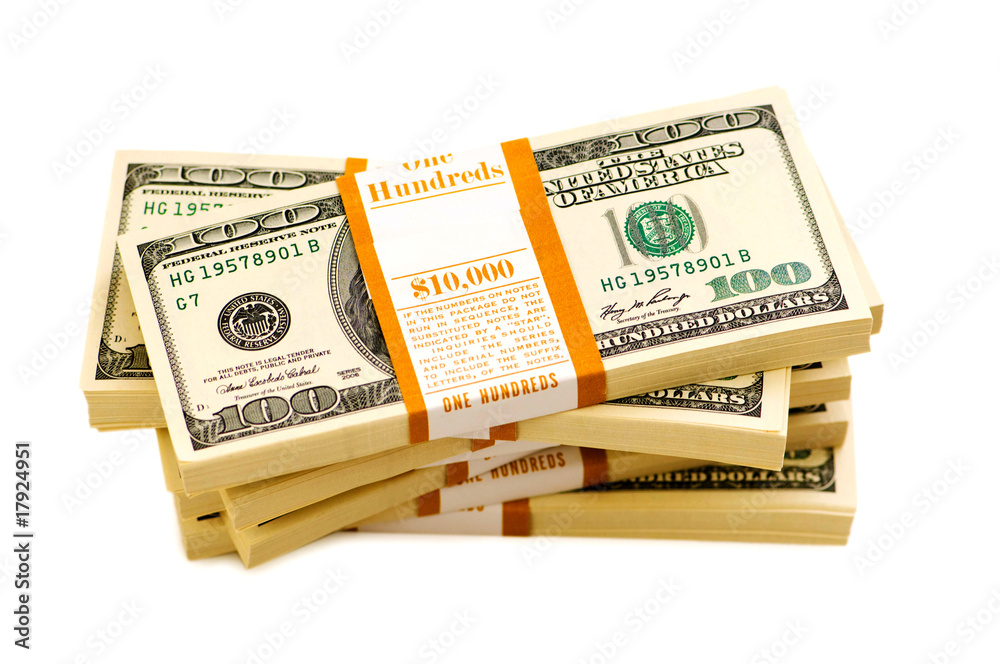 Stack of dollars isolated on the white Stack of dollars isolated on the white
