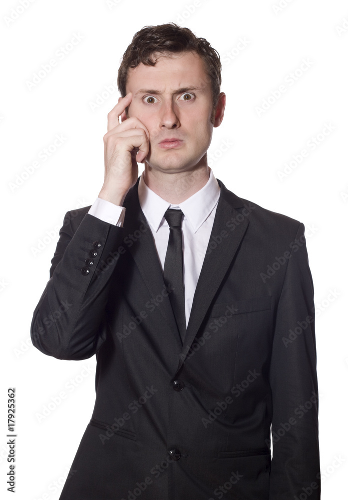 baffled businessman scratching his head baffled businessman scratching his head