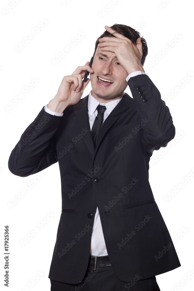 businessman with a mobile phone and headache businessman with a mobile phone and headache