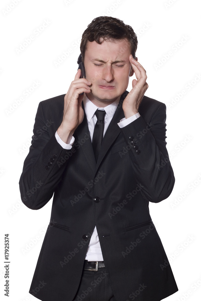 businessman with a mobile phone and headache businessman with a mobile phone and headache