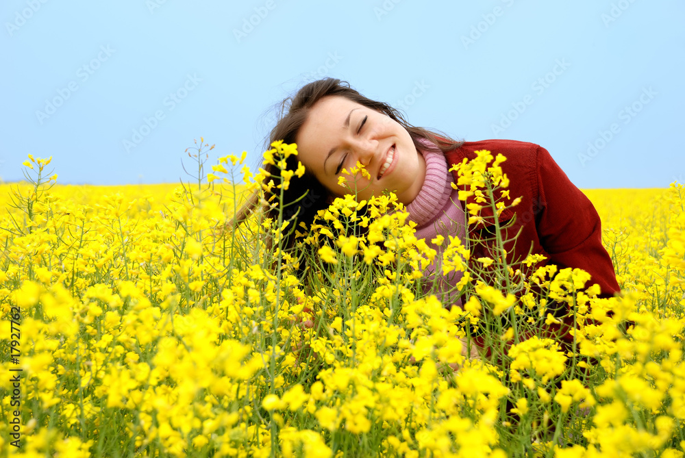 The young girl and yellow flowers The young girl and yellow flowers