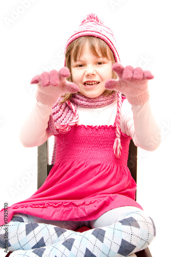 little girl wearing cap and gloves isolated on white