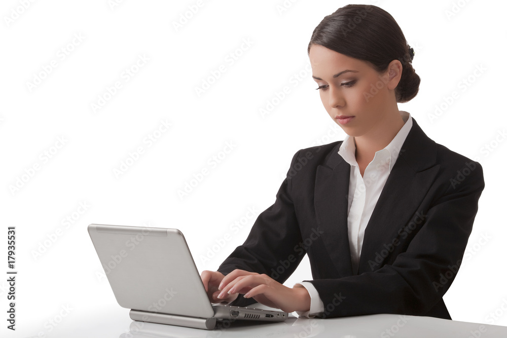 The young woman works on a computer The young woman works on a computer